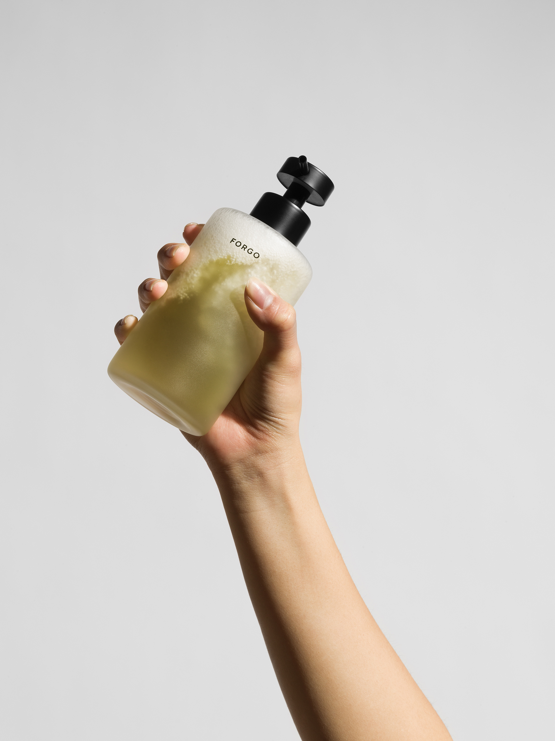 mixing water with the powder by shaking the bottle